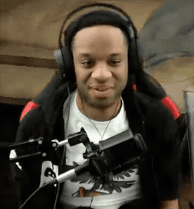 Man Wearing Headphones And Black Jacket At Microphone GIF