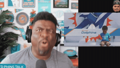 Man Wearing Headphones And Dolphins Shirt GIF