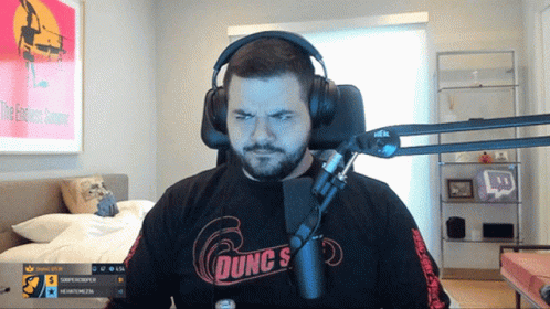Man Wearing Headphones And Dunc's Shirt GIF