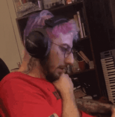 Man Wearing Headphones And Glasses At Piano GIF