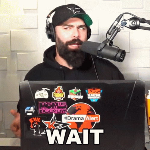 Man Wearing Headphones And Hat Behind Laptop Wait GIF