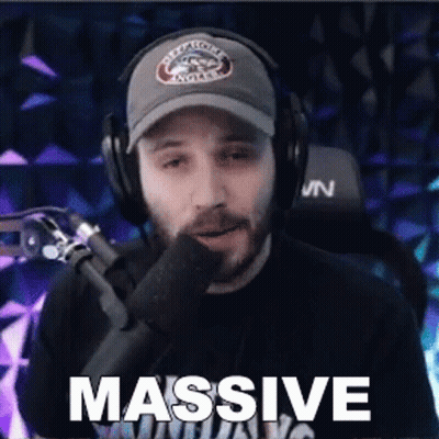 Man Wearing Headphones And Hat Saying Massive GIF