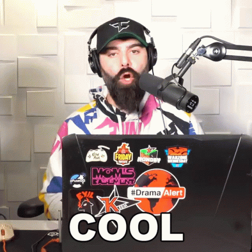 Man Wearing Headphones And Hat Stands In Front Of Microphone And Laptop Cool GIF
