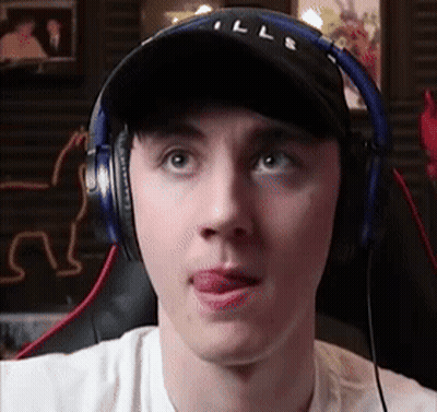Man Wearing Headphones And Hat Sticking Out Tongue GIF