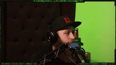Man Wearing Headphones And Hat With D Speaking GIF