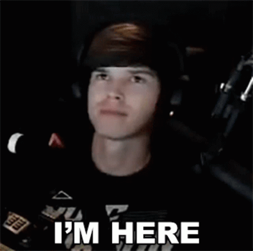 Man Wearing Headphones And Headband Says I'm Here GIF
