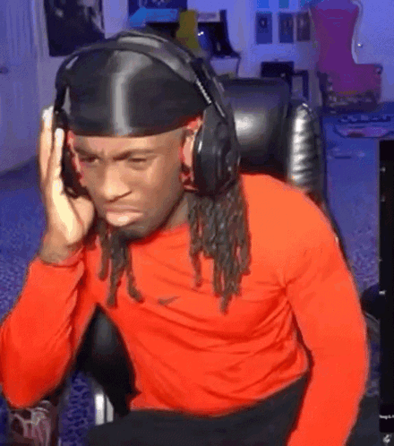 Man Wearing Headphones And Headband Sitting At Computer GIF