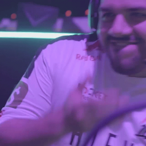 Man Wearing Headphones And Red Bull Shirt Smiles GIF