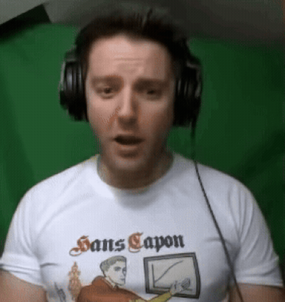 Man Wearing Headphones And Sans Capon Shirt GIF