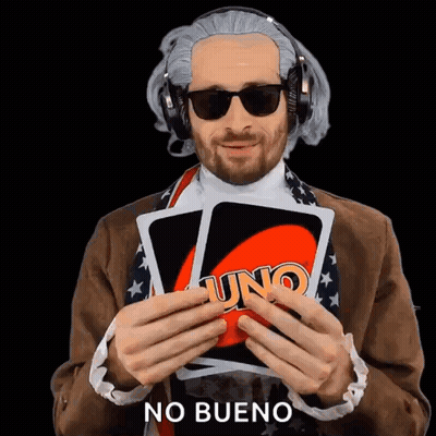Man Wearing Headphones and Sunglasses Holding Uno Card