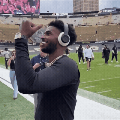 Man Wearing Headphones And Watch On Football Field GIF