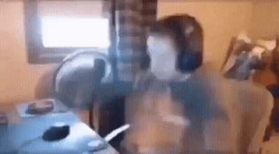Man Wearing Headphones At Desk GIF