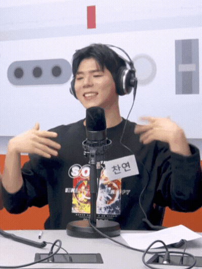 Man Wearing Headphones At Microphone GIF