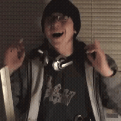 Man Wearing Headphones Dancing In Front Of Window GIF