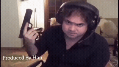 Man Wearing Headphones Holding Gun GIF