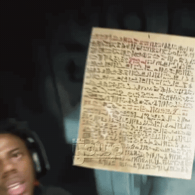 Man Wearing Headphones Holding Paper With Writing GIF