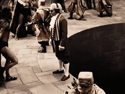 Man Wearing Headphones In Front Of Crowd GIF