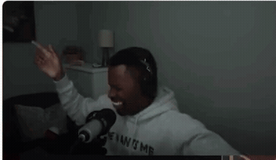Man Wearing Headphones In Front Of Microphone GIF