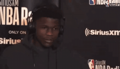 Man Wearing Headphones In Front Of Sirius XM GIF