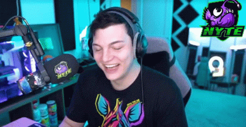 Man Wearing Headphones In Gaming Room GIF
