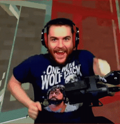 Man Wearing Headphones In One Man Wolf Pack Shirt GIF