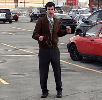 Man Wearing Headphones In Parking Lot GIF