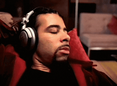 Man Wearing Headphones Laying On Couch GIF