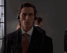 Man Wearing Headphones Looking At Camera GIF