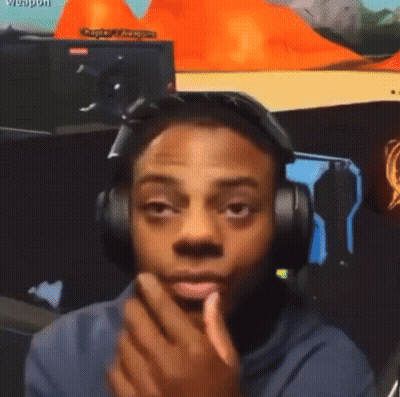 Man Wearing Headphones Looking At Camera With Weapon GIF