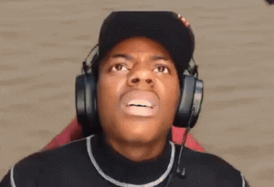 Man Wearing Headphones Making Funny Face With Eyes Closed GIF