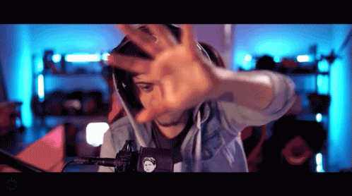 Man Wearing Headphones Making Hand Gesture GIF