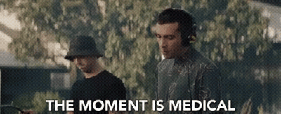 Man Wearing Headphones Next To Man In Bucket Hat GIF