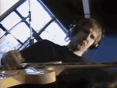 Man Wearing Headphones Playing Guitar GIF