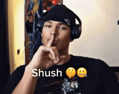 Man Wearing Headphones Saying Shush GIF