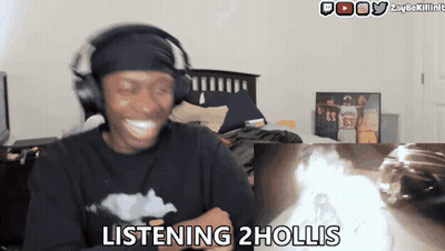 Man Wearing Headphones Says Listening 2 Hollis In Front Of Fire GIF