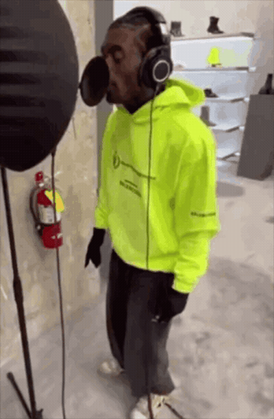 Man Wearing Headphones Singing Into Microphone GIF