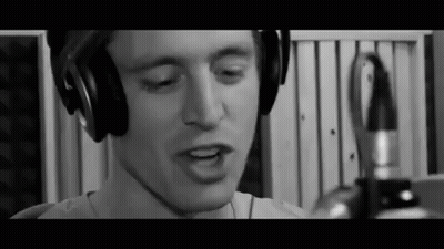 Man Wearing Headphones Singing Into Microphone GIF