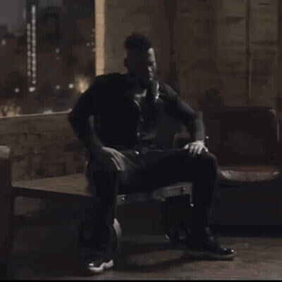 Man Wearing Headphones Sitting GIF