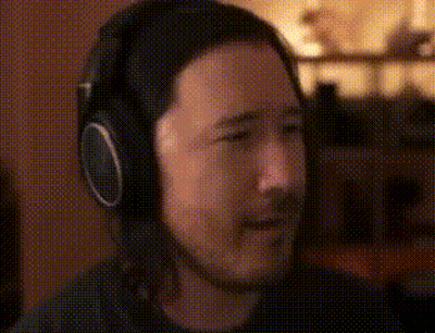 Man Wearing Headphones Sitting At Microphone GIF