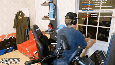 Man Wearing Headphones Sitting By Window GIF