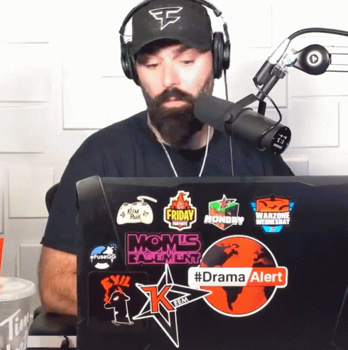 Man Wearing Headphones Sitting In Front Of Laptop With Dramaalert Sticker GIF