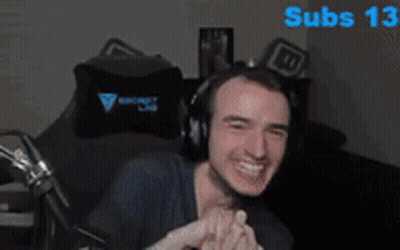 Man Wearing Headphones Sitting With Subs 13 Behind GIF