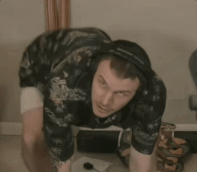 Man Wearing Headphones Squatting GIF