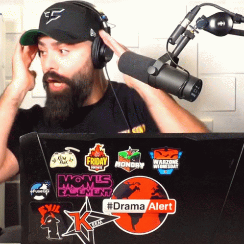 Man Wearing Headphones Stands In Front Of Microphone And Laptop With #Dramaalert GIF