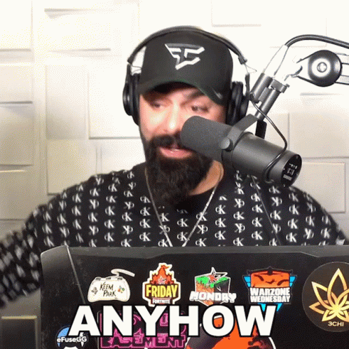 Man Wearing Headphones Stands In Front Of Microphone Laptop With Stickers Anyhow GIF