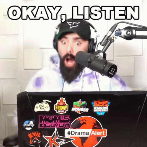 Man Wearing Headphones Stands In Front Of Microphone Saying Okay Listen GIF