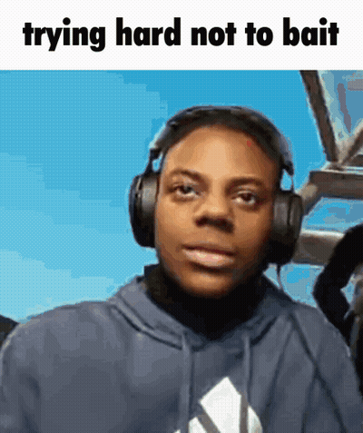 Man Wearing Headphones Trying Hard Not To Bait GIF