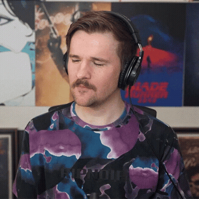 Man Wearing Headphones With Blade Runner Poster GIF