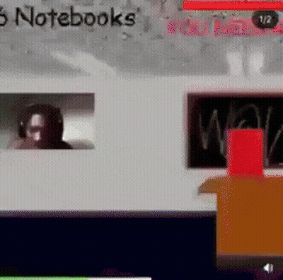 Man Wearing Headphones With Notebooks On Screen GIF