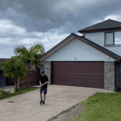 Man Wearing Helmet In Front Of House GIF
